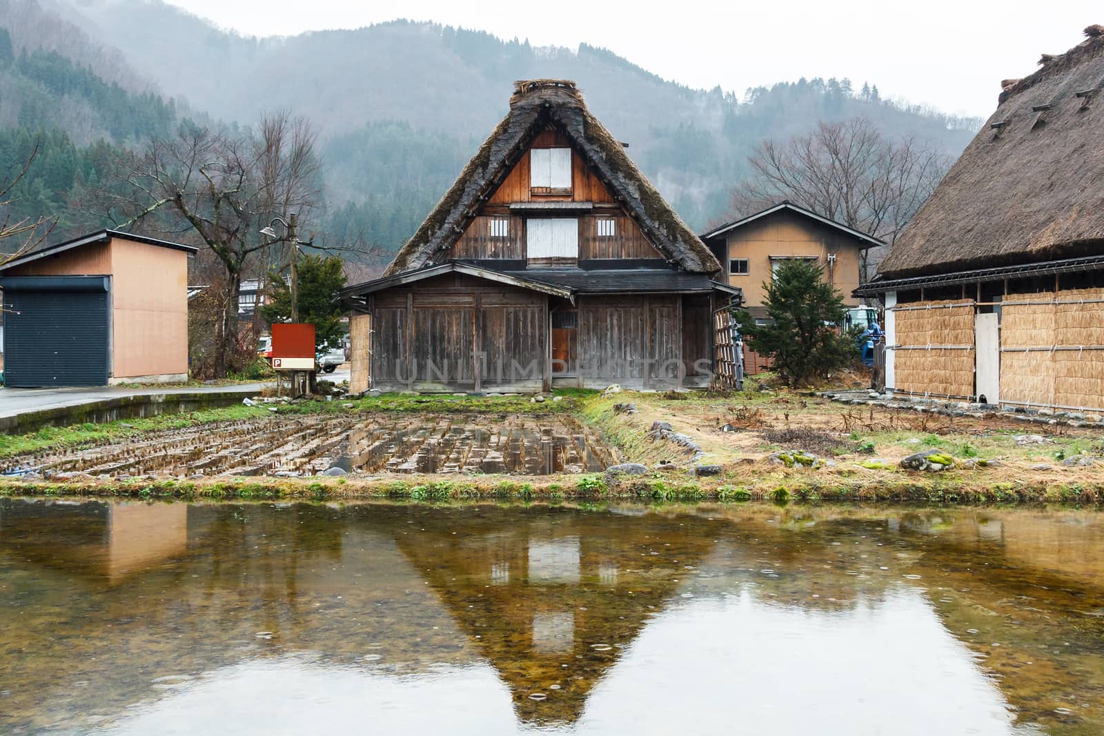 Reflect of house at Shirakawago in water.