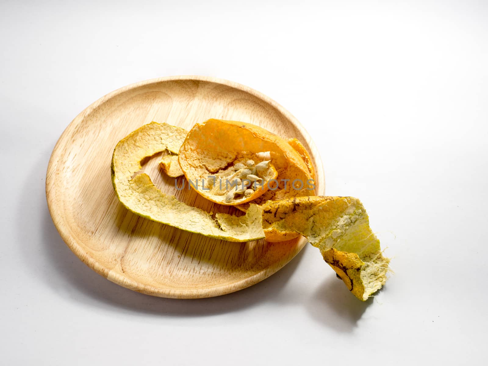 orange's peel and seeds on white background