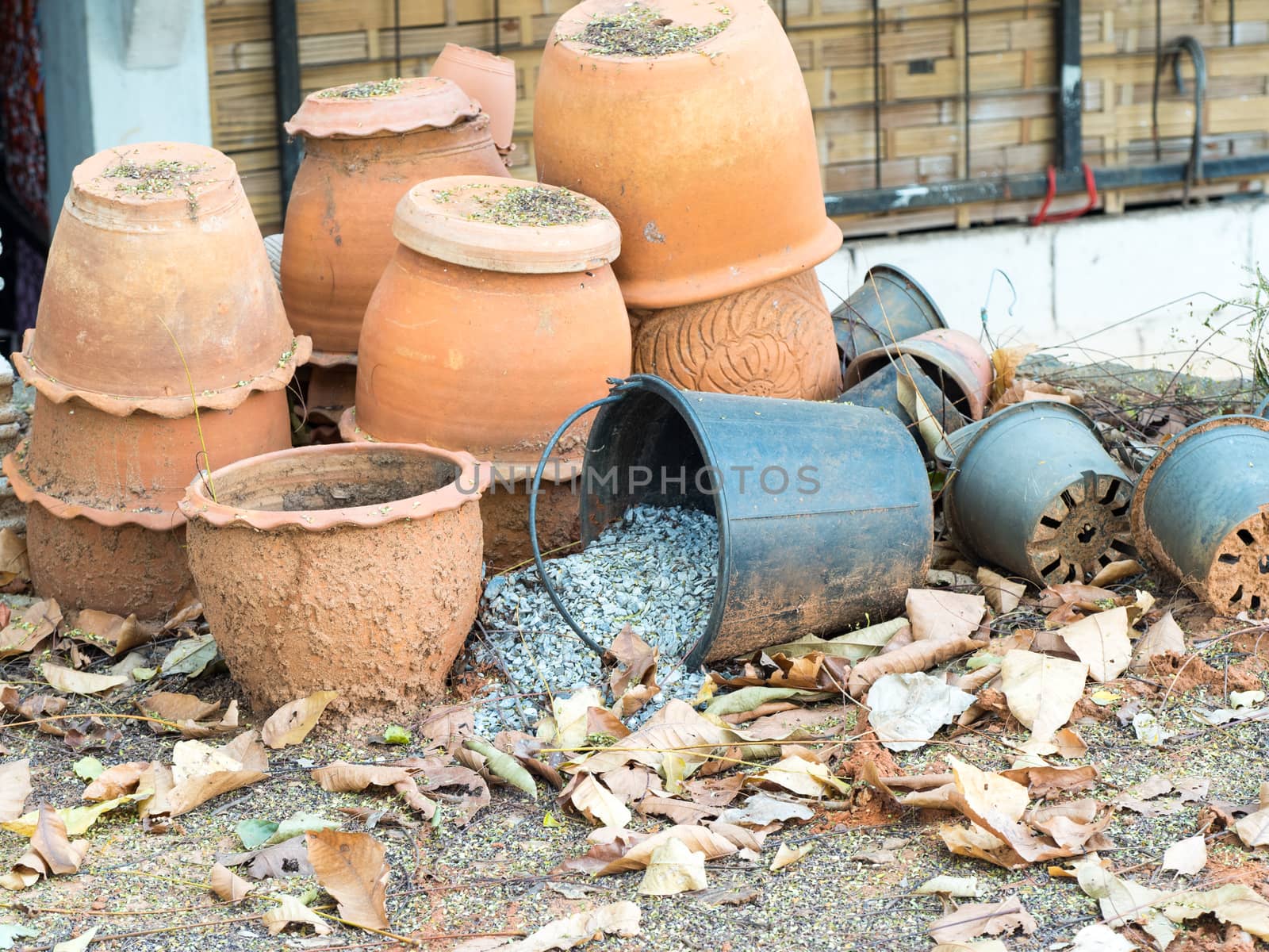 old clay pots and plastic pots