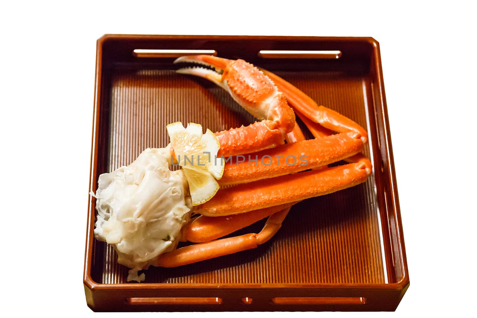 Isolated king crab leg in plate.