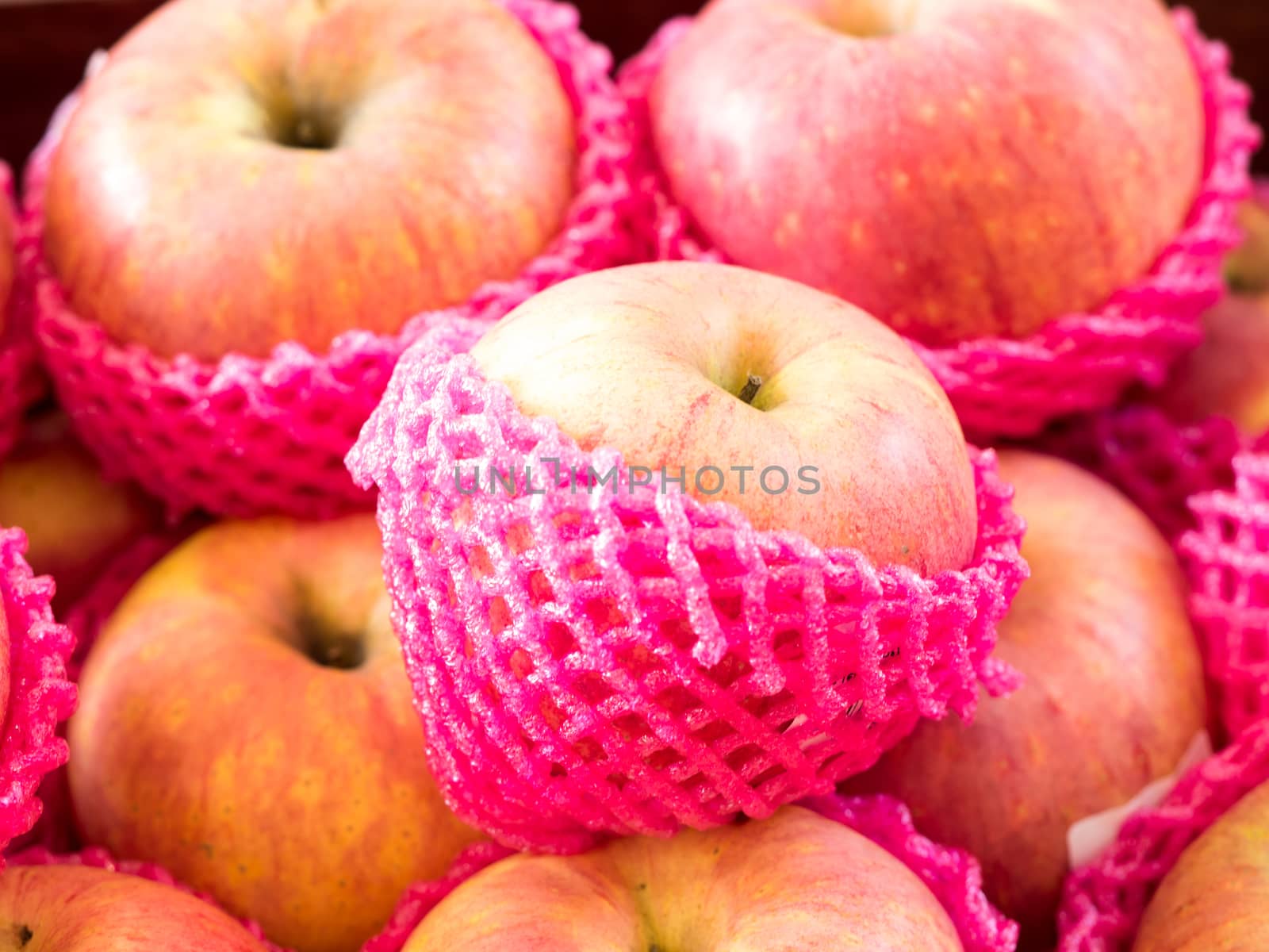Apple wrapped with foam fruit net,select focus