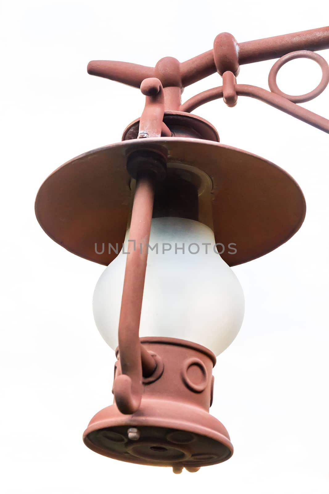 Isolated lantern hanging on the pole with white background.