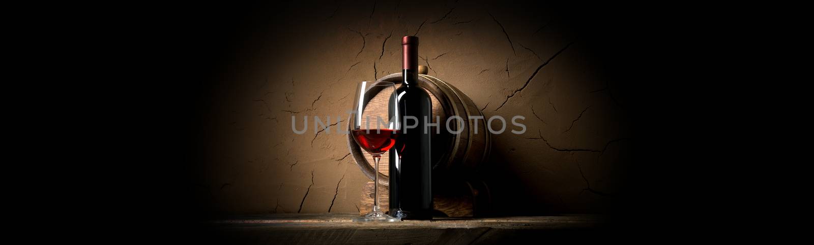 Wine on a background of old clay wall