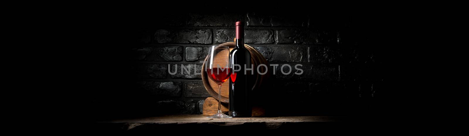 Red wine on a background of black bricks