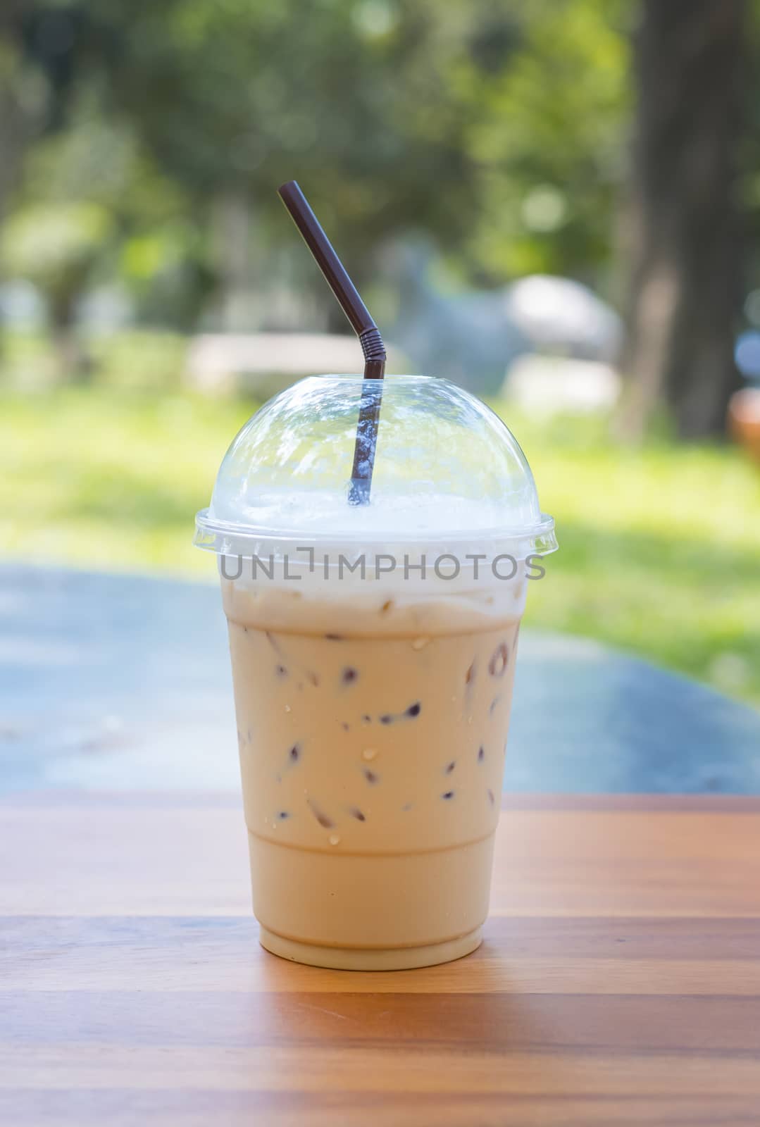 Cold milk coffee and ice in glass