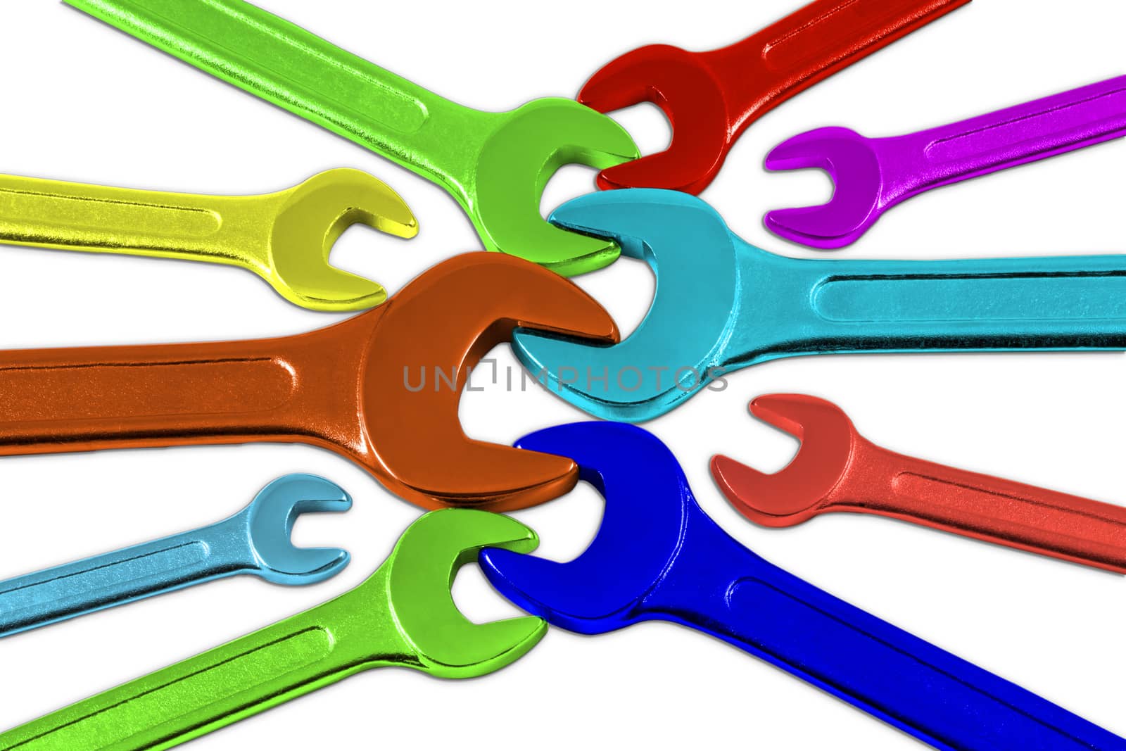 Set of multicolored wrenches on a colored background.