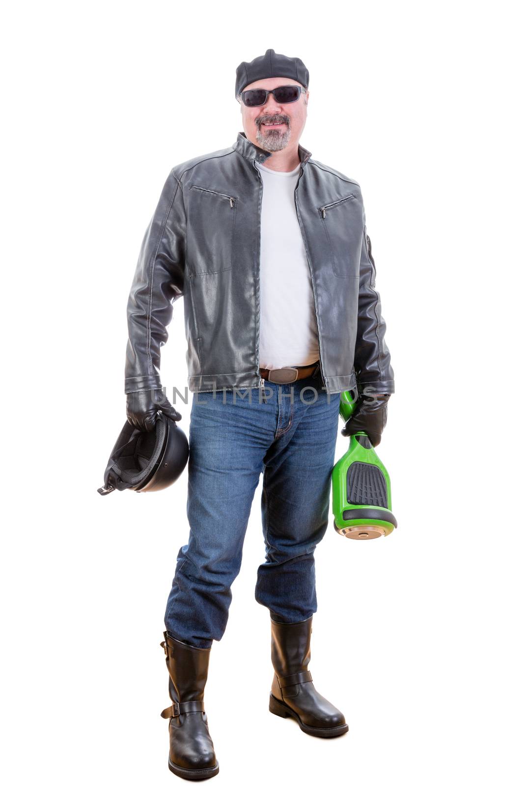 Smiling single middle aged male in sunglasses, jeans and leather jacket proudly holding helmet with hoverboard