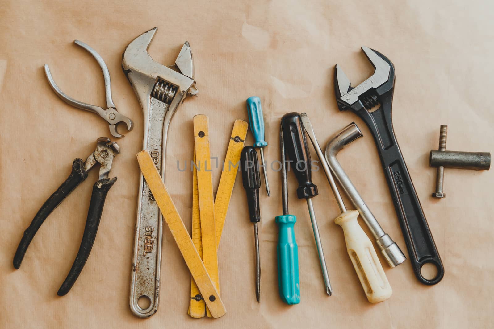 Set of hand tools on craft paper background