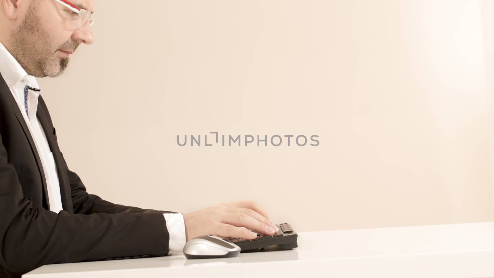 Business man using keyboard computer white background
