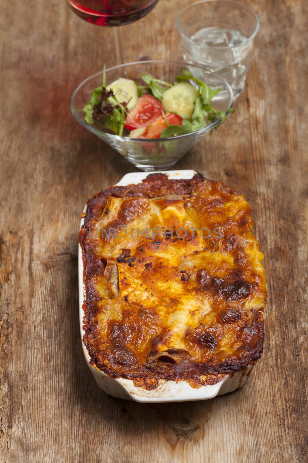 homemade lasagna on rustic wood