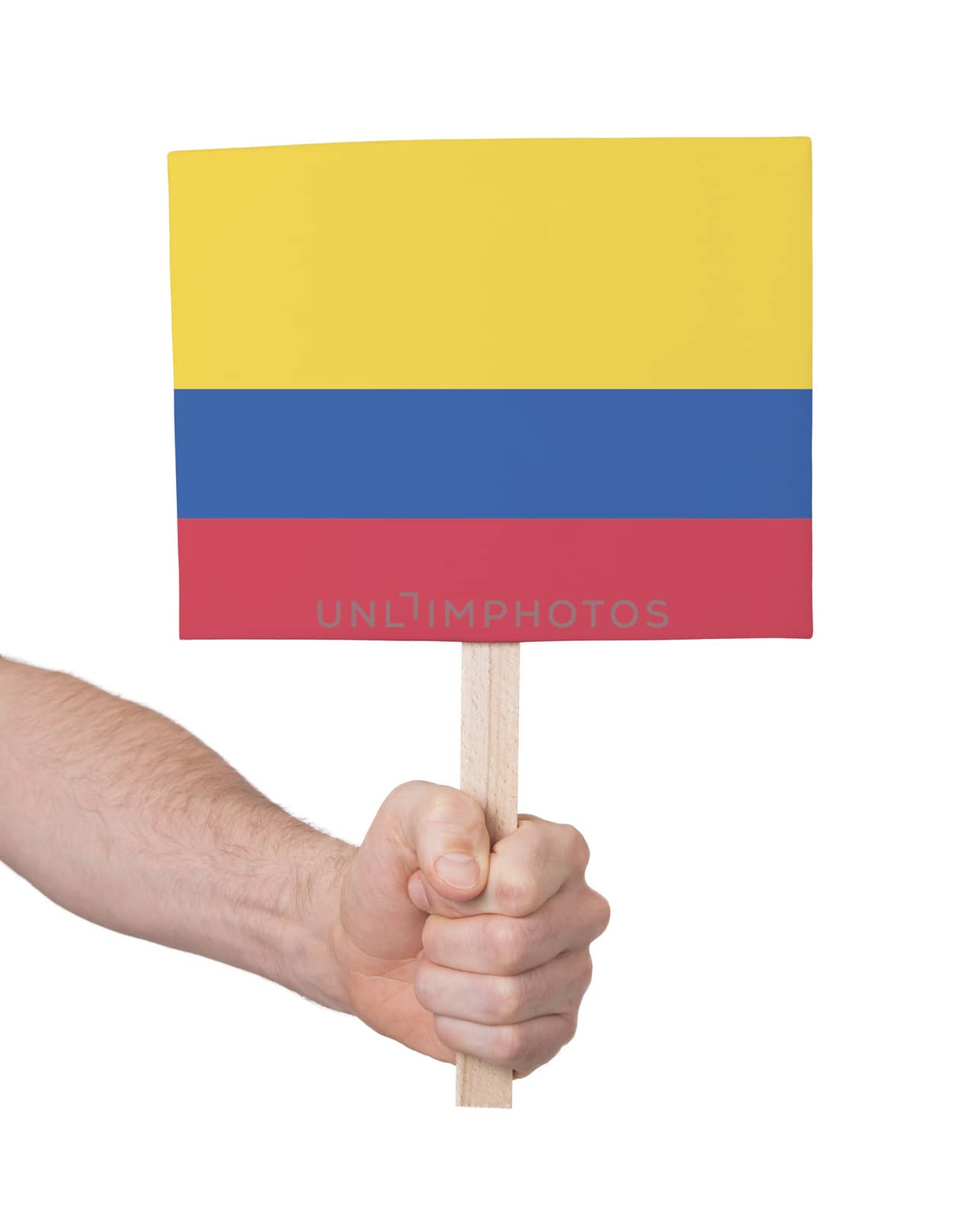 Hand holding small card - Flag of Colombia by michaklootwijk