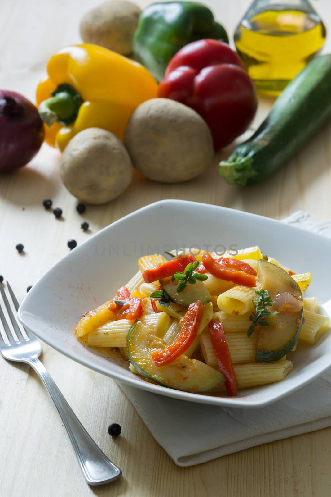 Italian pasta served with vegetable dressing