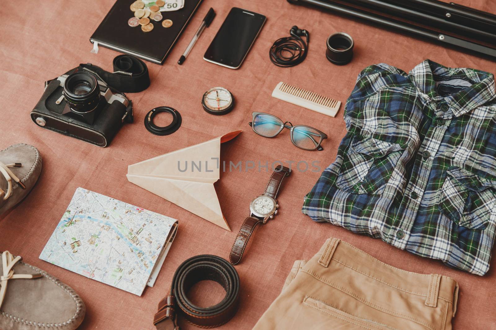 Trip concept - set of cool photography man stuff on linen cloth background by vladdeep