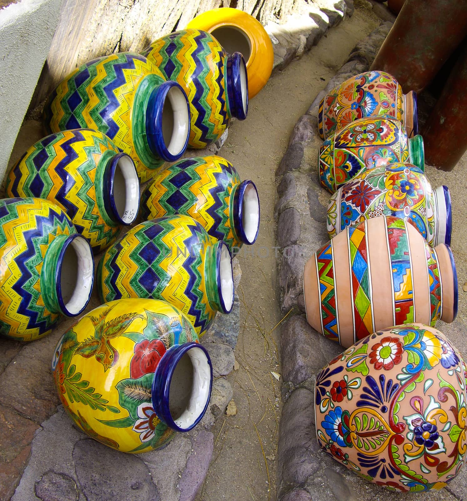 Mexican pottery arranged on ground by emattil