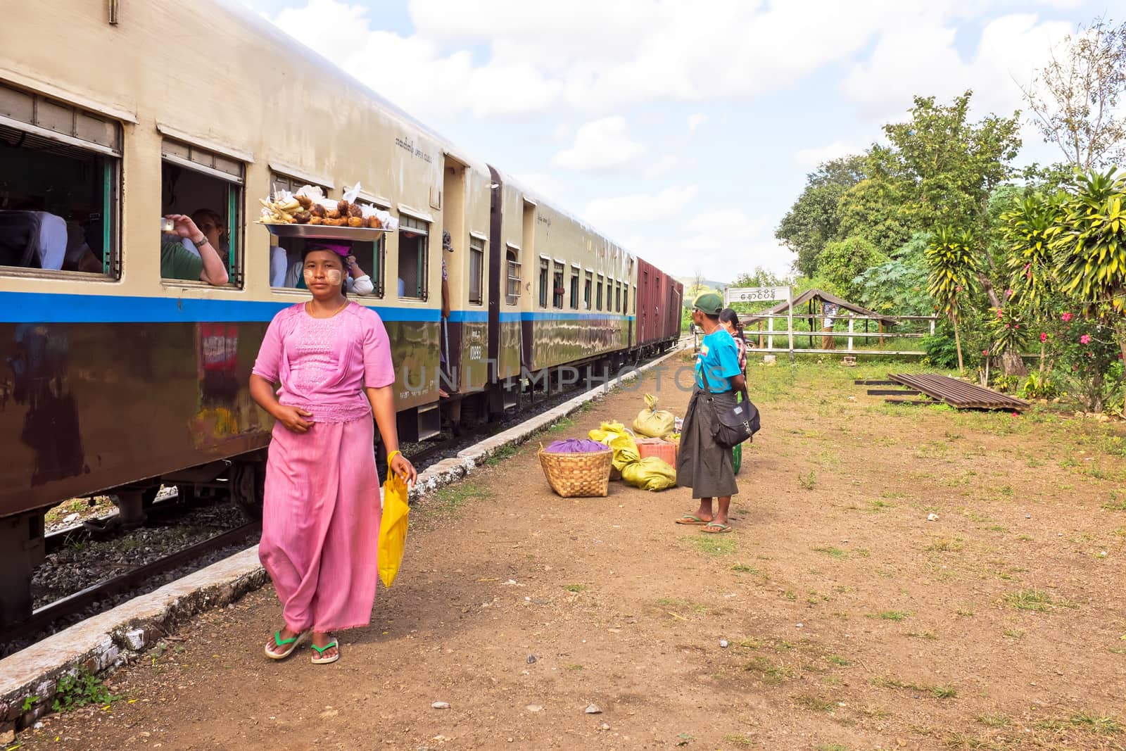 BAGO, MYANMAR - November 16, 2015: Hawkers selling goodies. Trains in lower Myanmar are little communities of their own with hawkers selling everything imaginable.