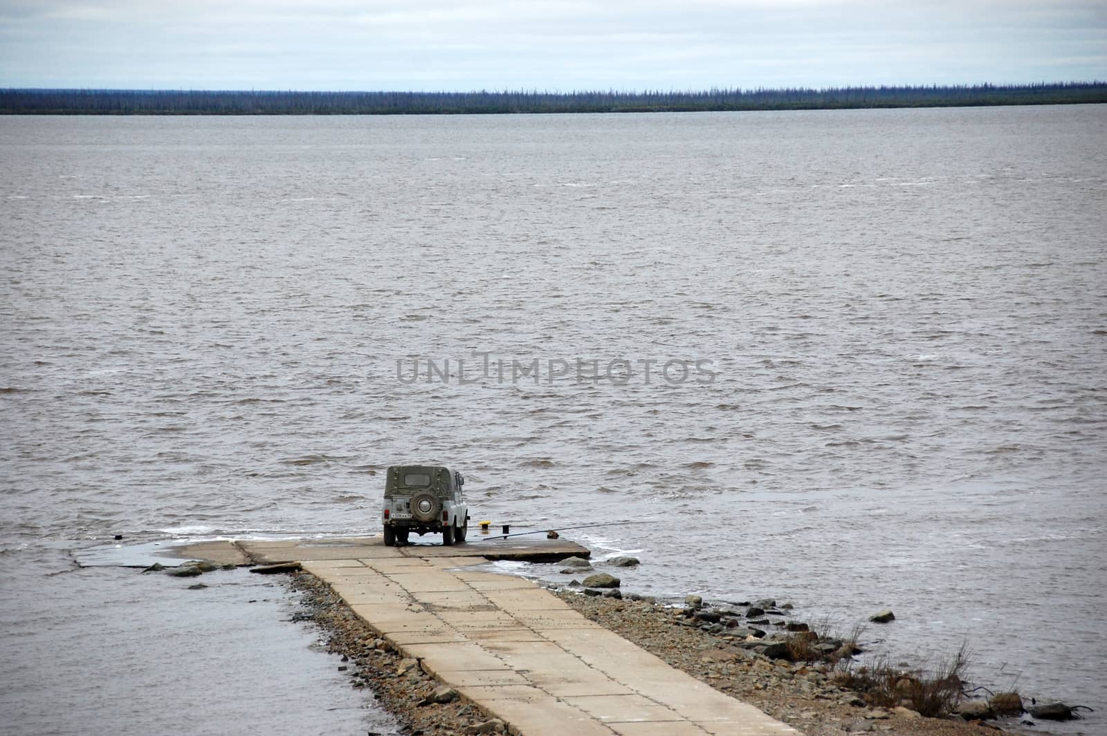 Car at jetty Kolyma river, Chersky region, Yakutia, Russia