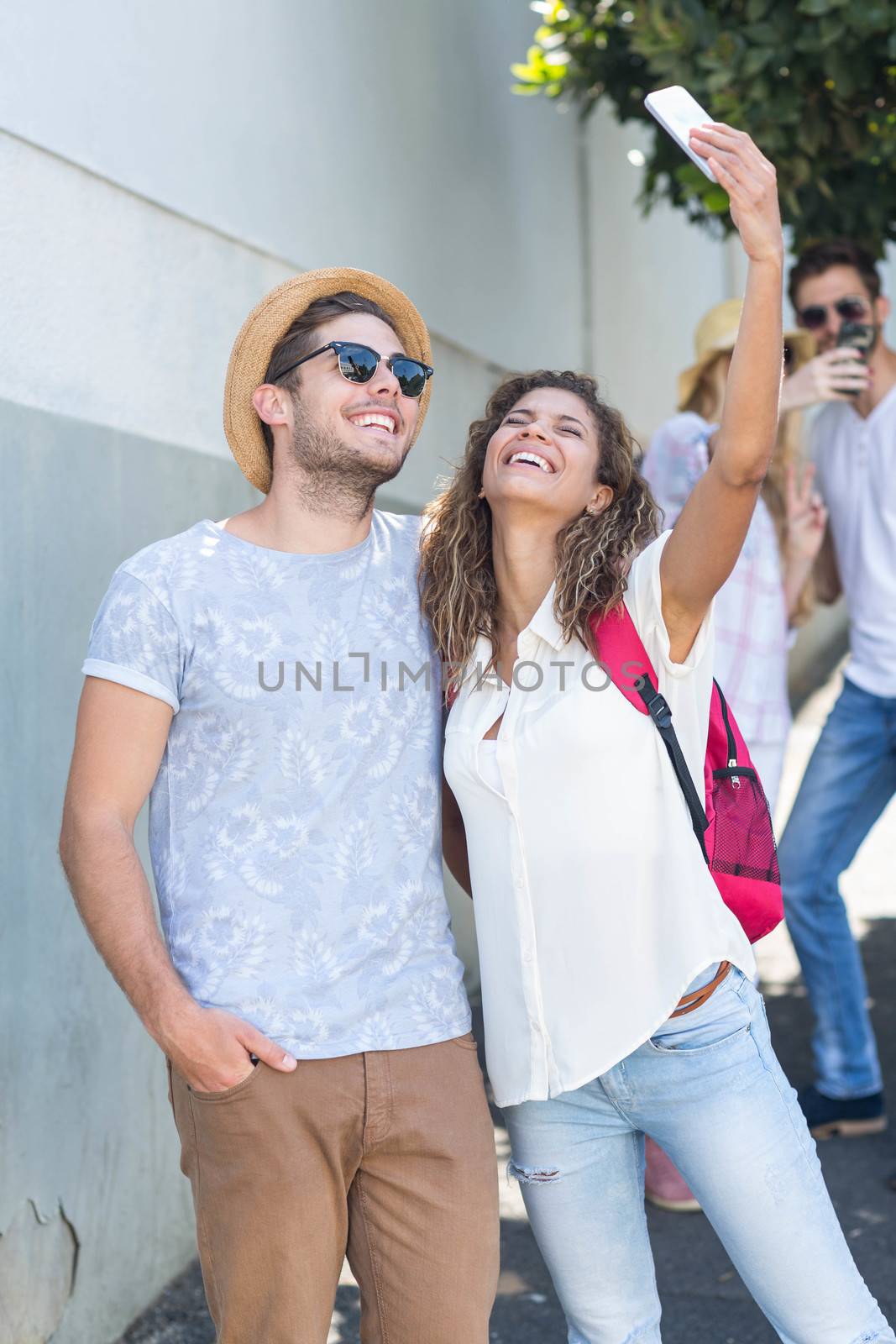 Hip couple taking selfie by Wavebreakmedia