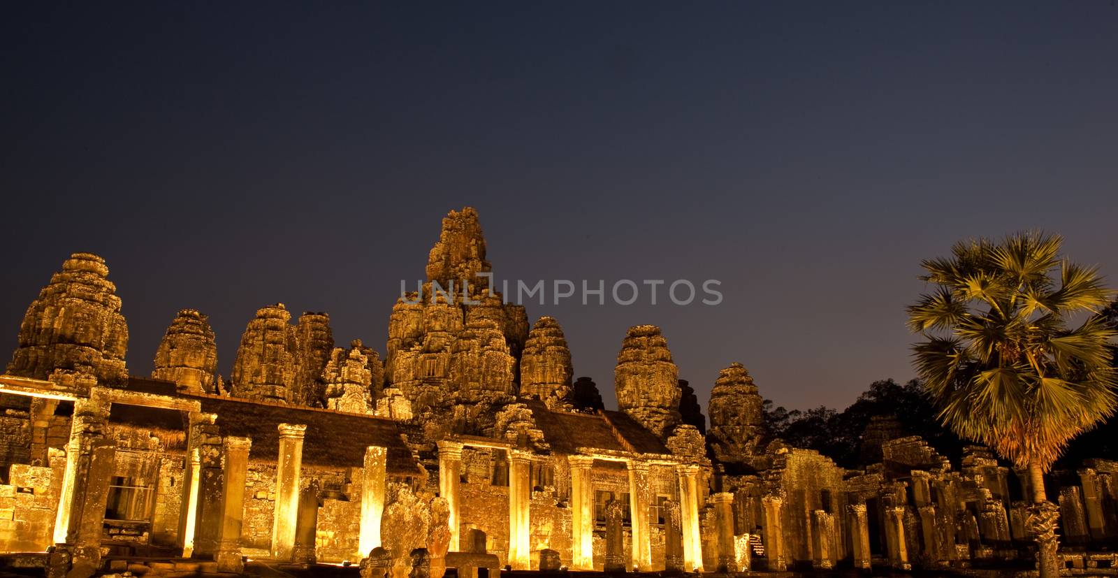 Bayon, the  main Temple of Angkor Thom near Angkor Wat, lit up at night for an event.