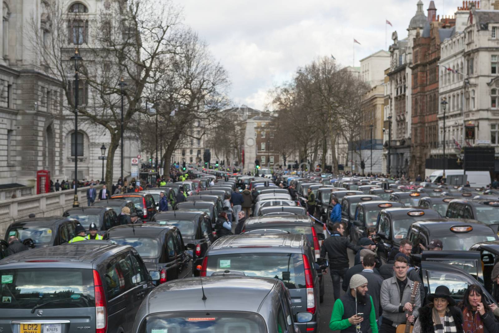 UNITED-KINGDOM, London: Dozens of black cab drivers stage a protest in central London, causing gridlock to Whitehall and Trafalgar Square as taxi drivers hold another protest under the hashtag #Blackcabprotest against competition from app-based taxi services, and especially US company Uber, on February 10, 2016. Since its introduction in Britain, drivers of the city's famous black cabs have argued Uber bypasses local licensing and safety laws and amounts to unfair competition. They have staged a number of high-profile protests, including go-slow demonstrations that have brought traffic in the centre of London from Trafalgar Square to Victoria street.