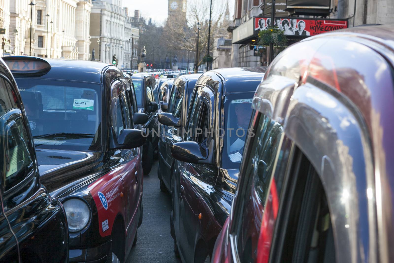 UNITED-KINGDOM, London: Dozens of black cab drivers stage a protest in central London, causing gridlock to Whitehall and Trafalgar Square as taxi drivers hold another protest under the hashtag #Blackcabprotest against competition from app-based taxi services, and especially US company Uber, on February 10, 2016. Since its introduction in Britain, drivers of the city's famous black cabs have argued Uber bypasses local licensing and safety laws and amounts to unfair competition. They have staged a number of high-profile protests, including go-slow demonstrations that have brought traffic in the centre of London from Trafalgar Square to Victoria street.