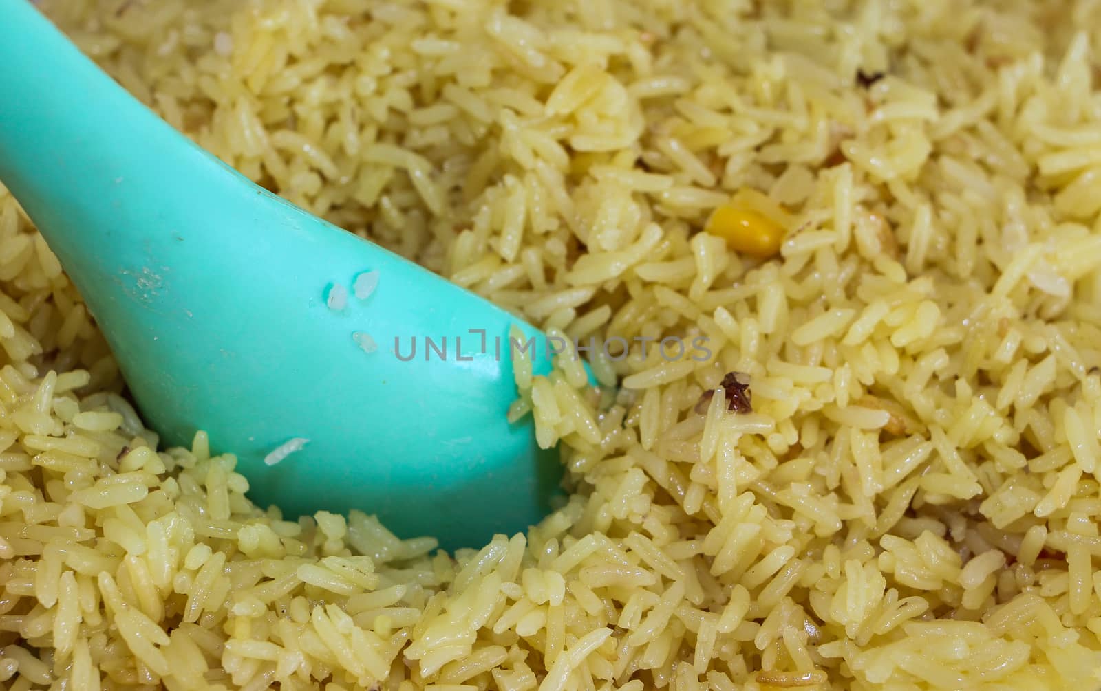 Close up of Yellow rice with spoon