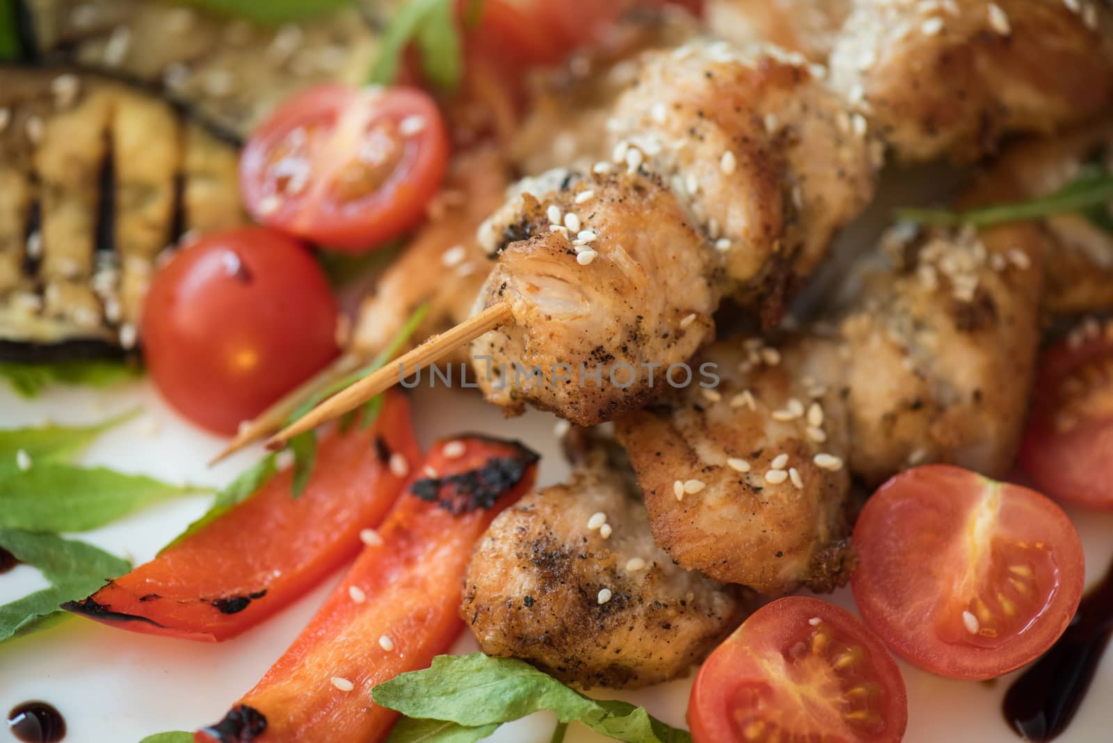Grilled kebab pork meat with roasted potato and vegetables