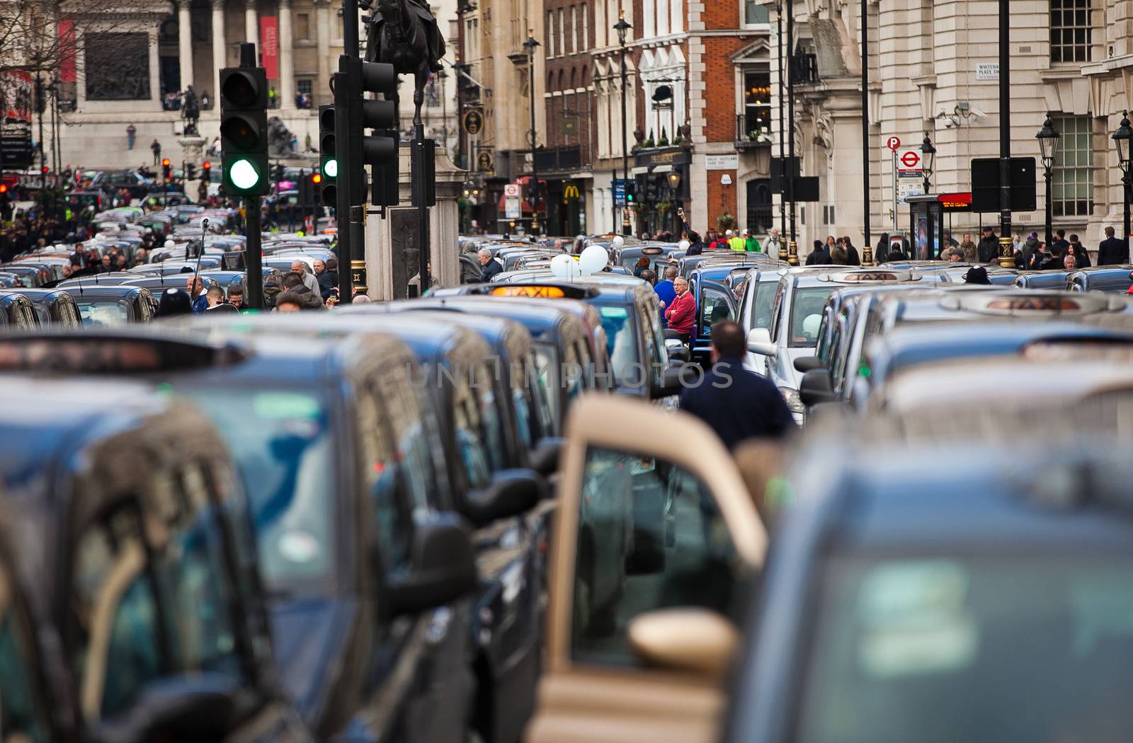 UNITED-KINGDOM, London: Dozens of black cab drivers stage a protest in central London, causing gridlock to Whitehall and Trafalgar Square as taxi drivers hold another protest under the hashtag #Blackcabprotest against competition from app-based taxi services, and especially US company Uber, on February 10, 2016. Since its introduction in Britain, drivers of the city's famous black cabs have argued Uber bypasses local licensing and safety laws and amounts to unfair competition. They have staged a number of high-profile protests, including go-slow demonstrations that have brought traffic in the centre of London from Trafalgar Square to Victoria street.