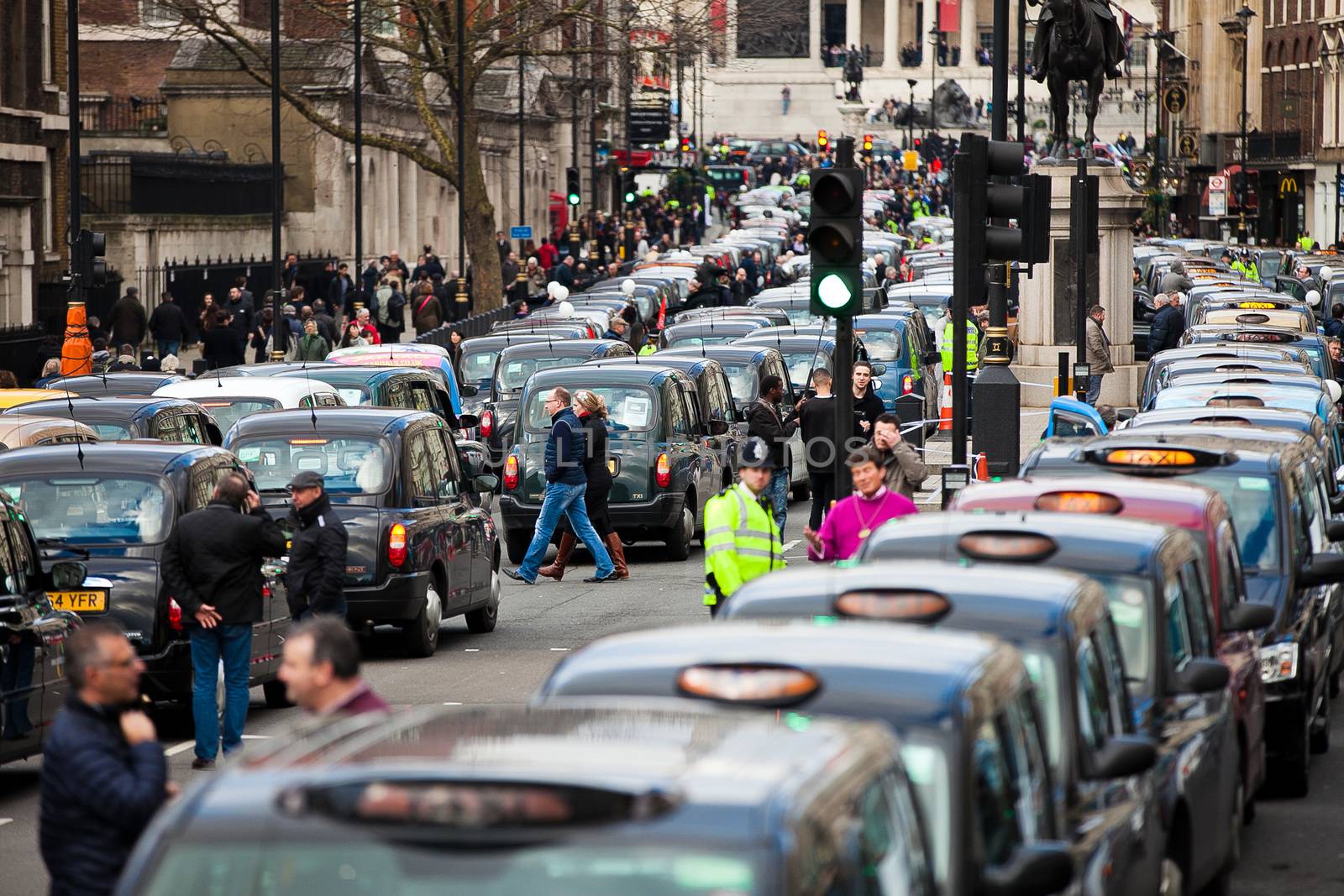 UNITED-KINGDOM, London: Dozens of black cab drivers stage a protest in central London, causing gridlock to Whitehall and Trafalgar Square as taxi drivers hold another protest under the hashtag #Blackcabprotest against competition from app-based taxi services, and especially US company Uber, on February 10, 2016. Since its introduction in Britain, drivers of the city's famous black cabs have argued Uber bypasses local licensing and safety laws and amounts to unfair competition. They have staged a number of high-profile protests, including go-slow demonstrations that have brought traffic in the centre of London from Trafalgar Square to Victoria street.