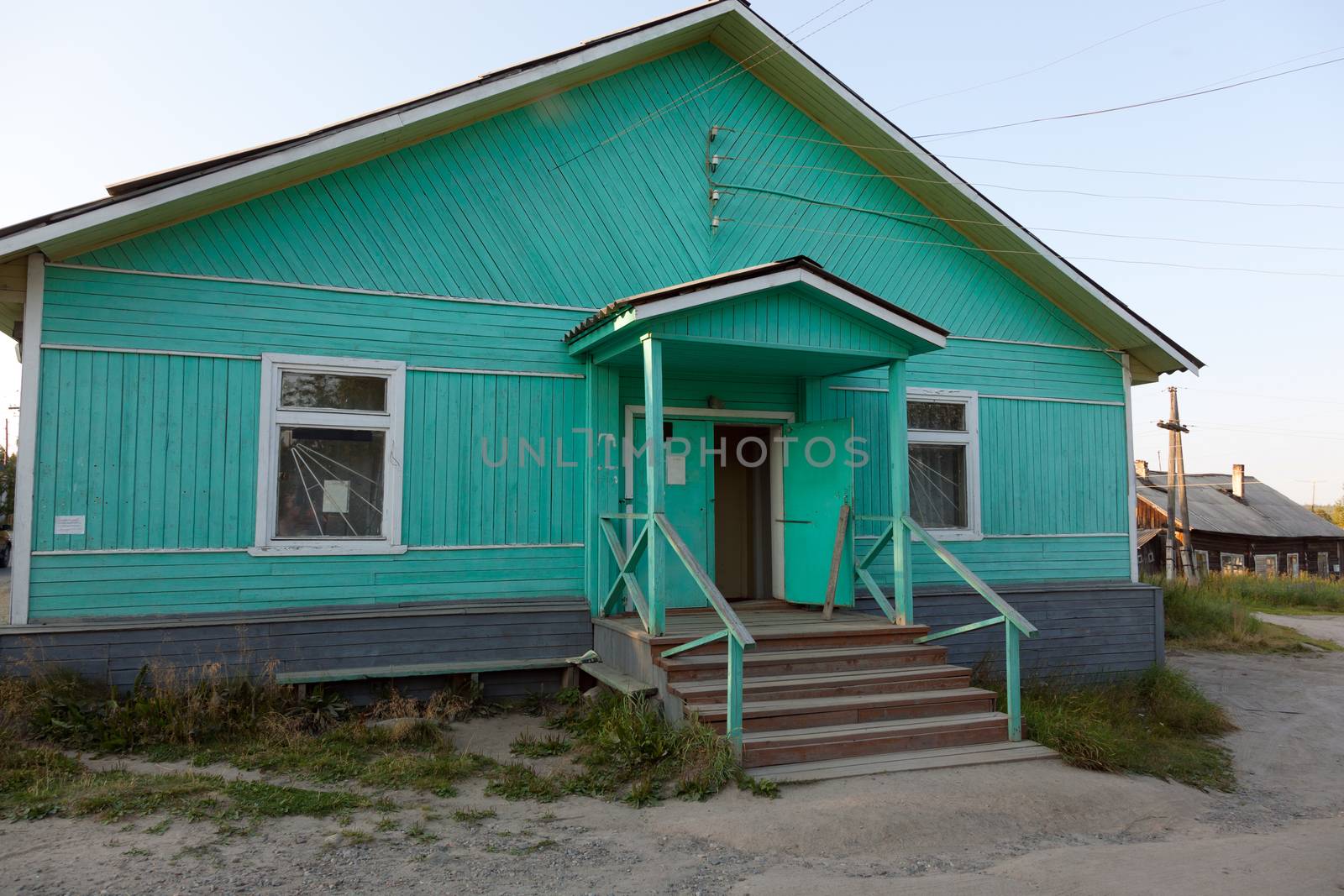The old blue wooden shop. Umba village, Murmansk region, Russia.