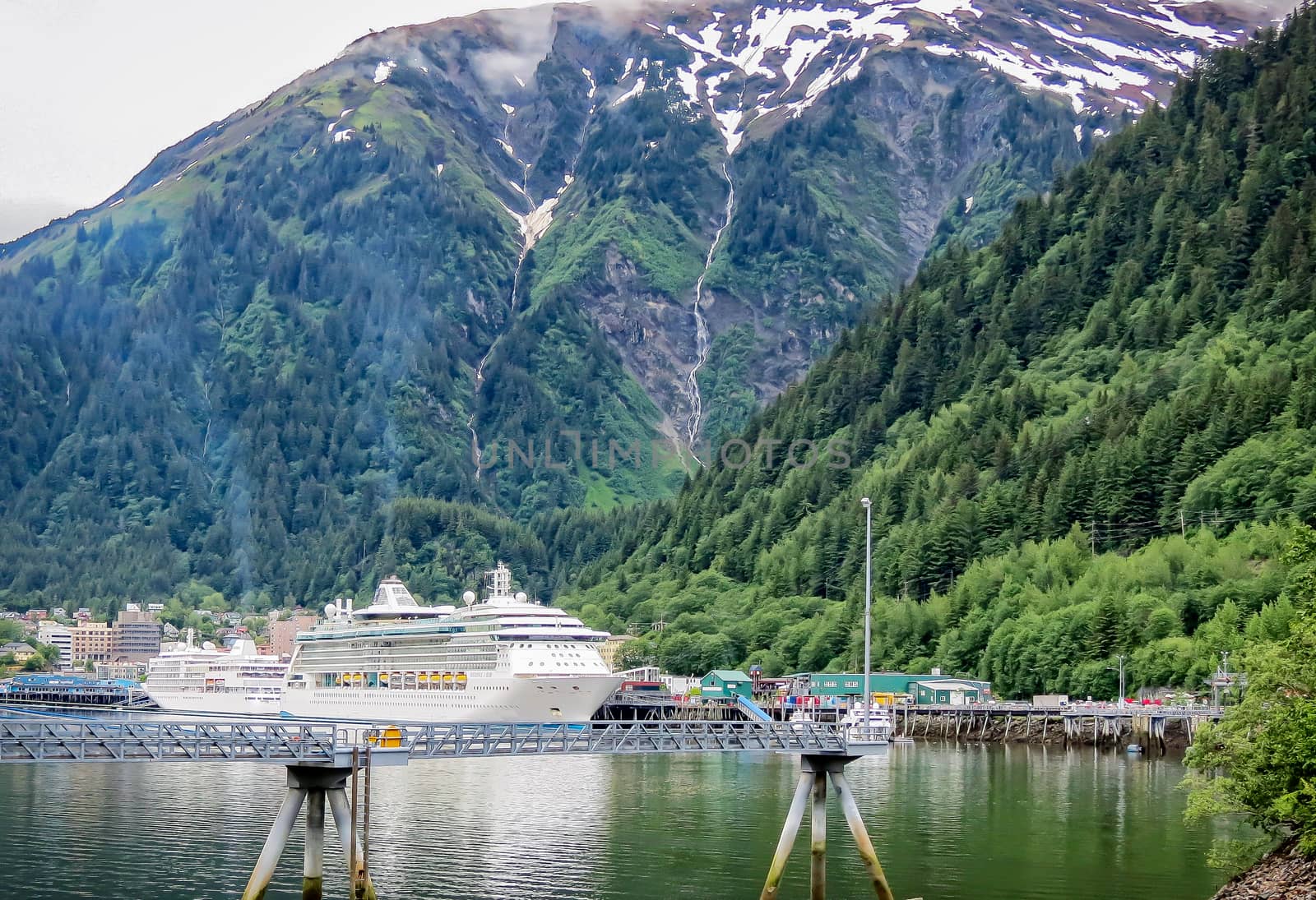 Juneau, Alaska, USA- June 17, 2012: A cruise ship is docked and unloading passengers at the terminal in the state capital of Alaska.