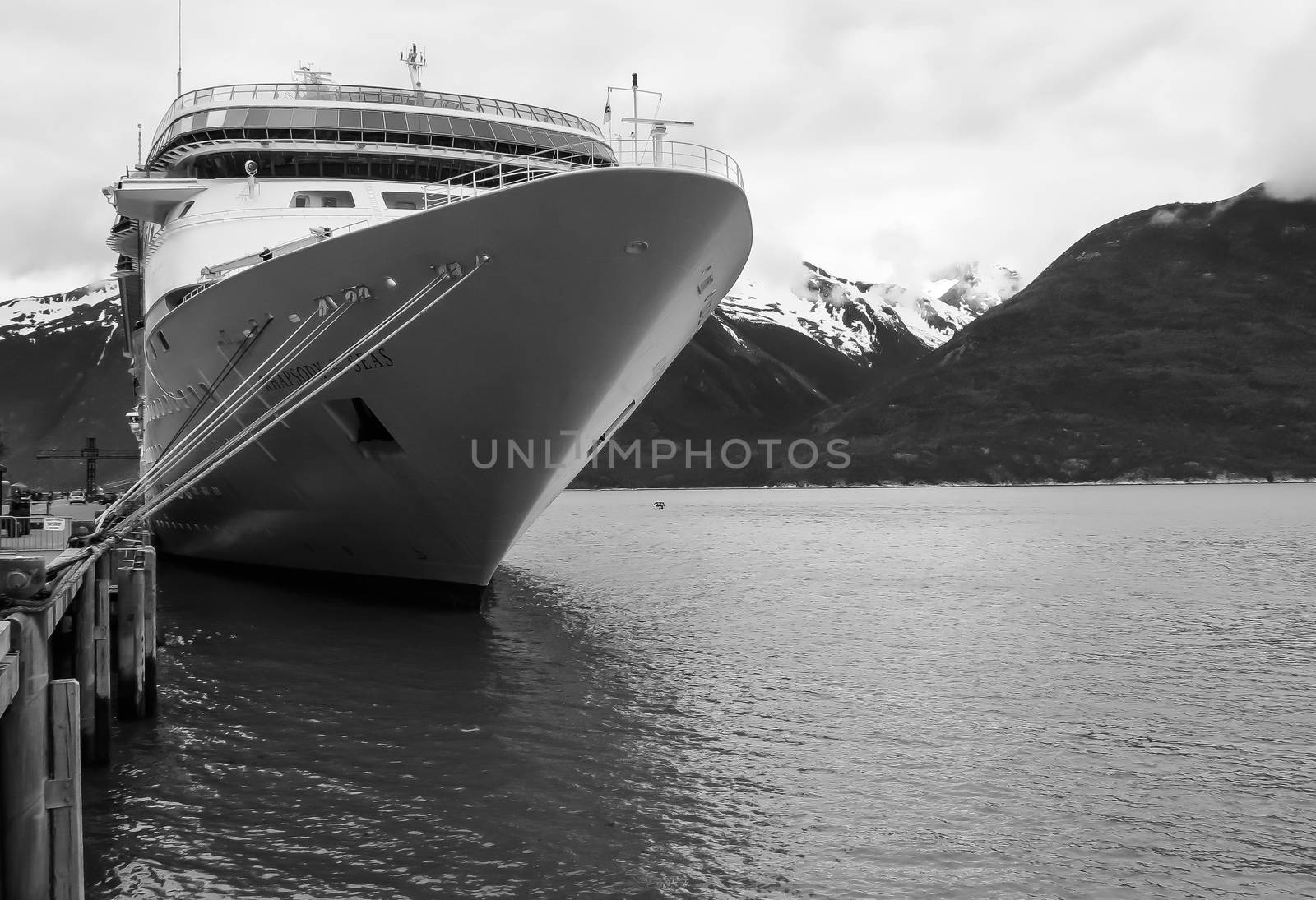 Skagway, Alaska, USA-June 18, 2012: A cruise ship is docked at the pier and waits to reload supplies and passengers at this popular cruise ship destination