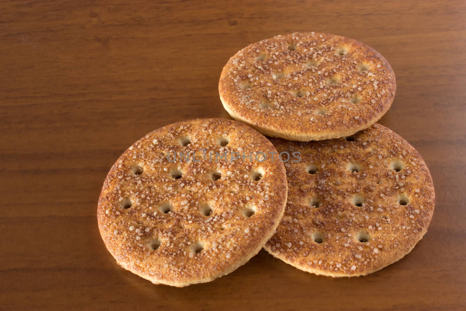 sugar cookies with cinnamon on dark brown table