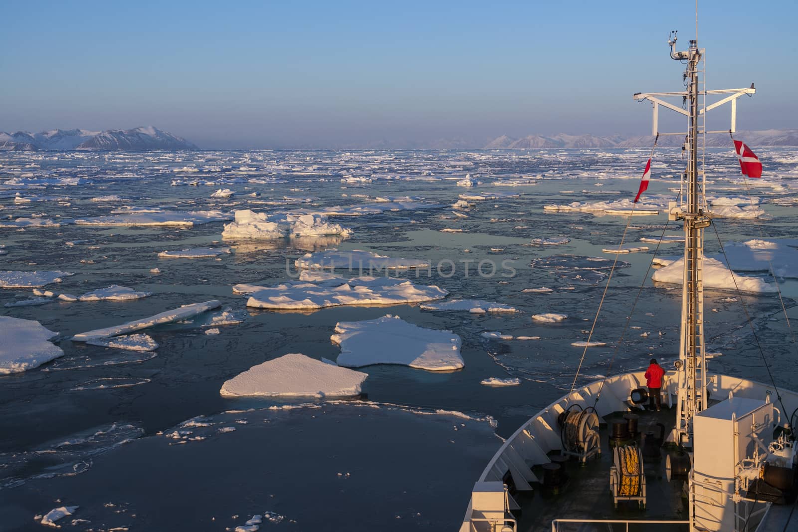 A tourist icebreaker and sea ice of the coast of eastern Greenland.