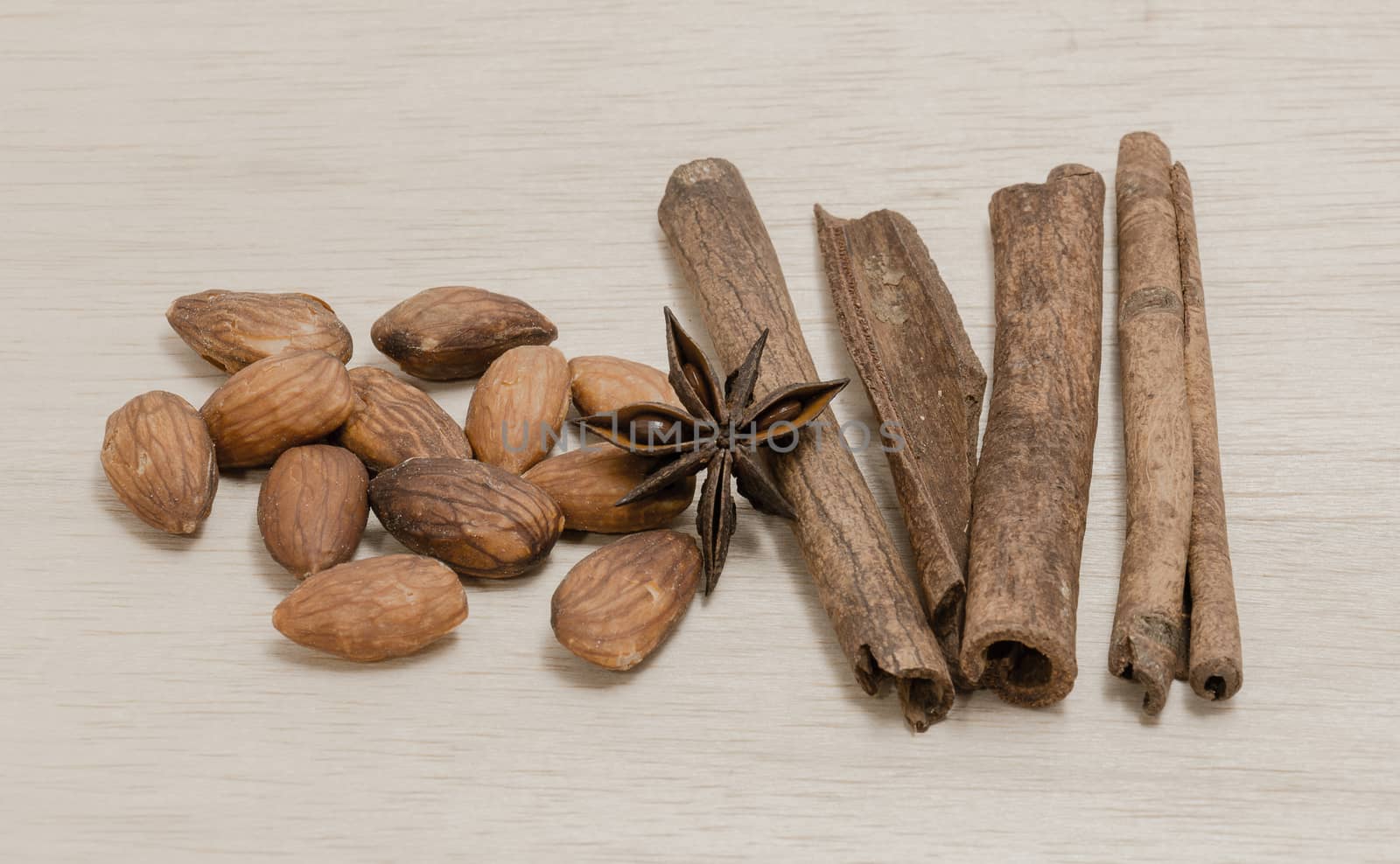 Random Spice on wood background almond cinnamon Star anise by chingraph