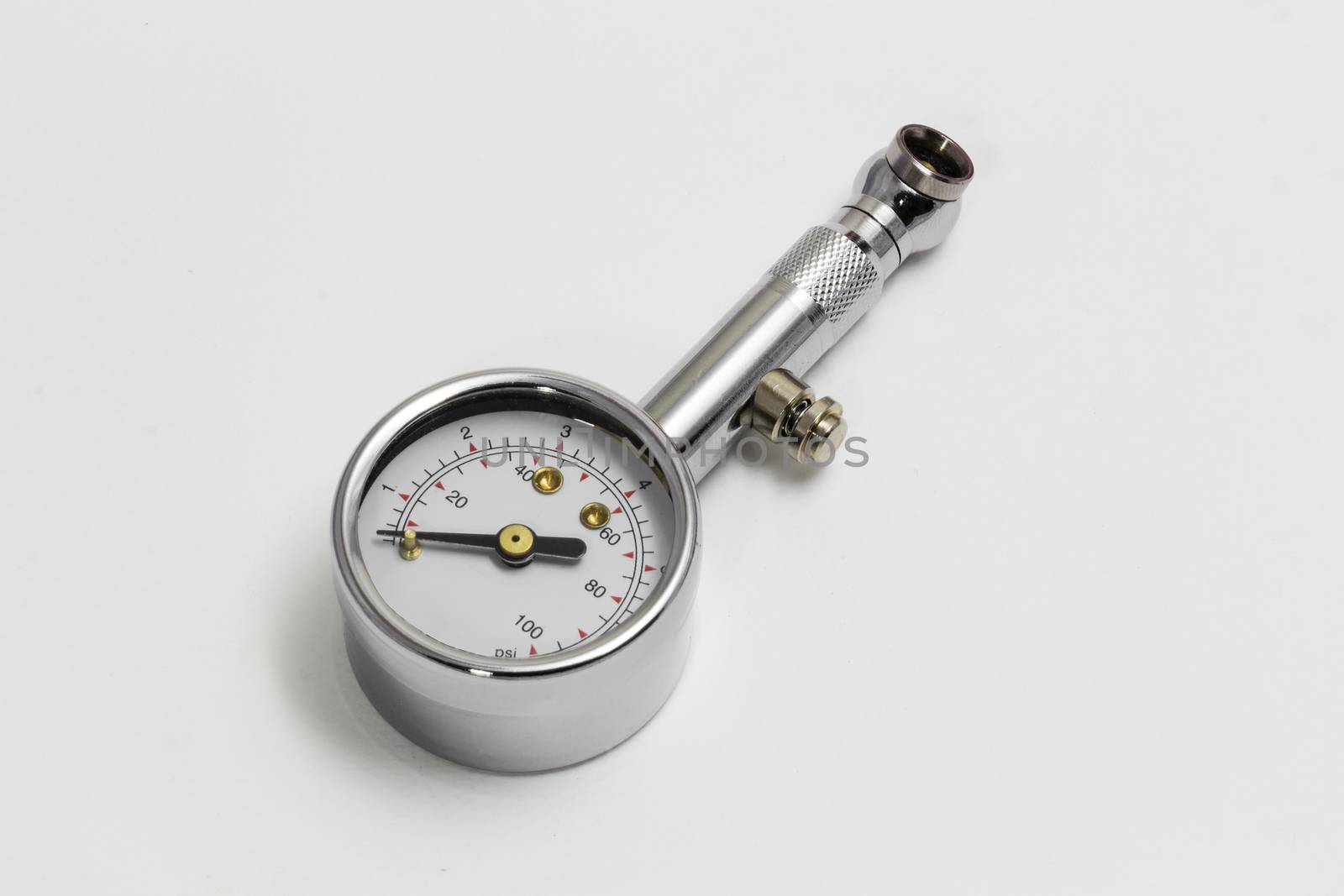 Tire pressure gauge isolated on white background by chingraph