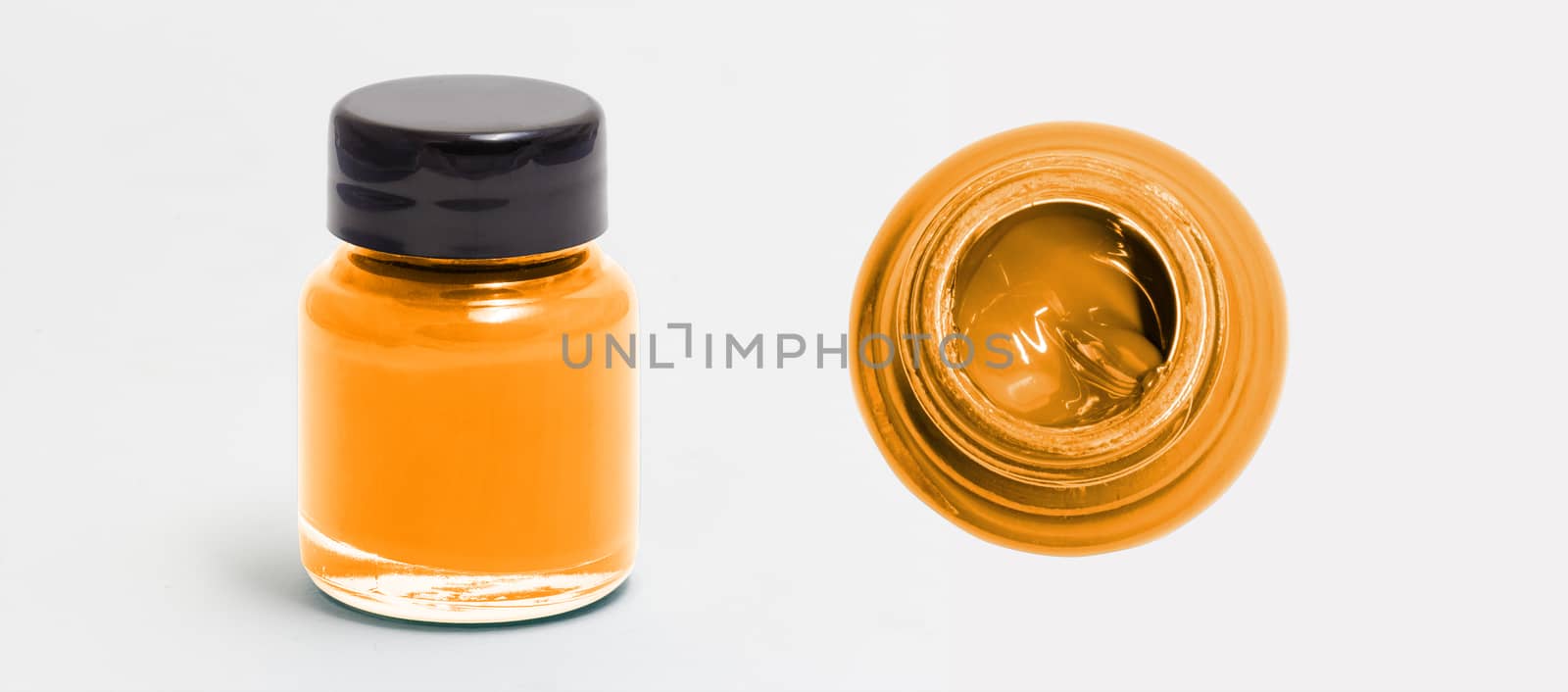 dark orange acrylic color bottle side and top view white isolate by chingraph