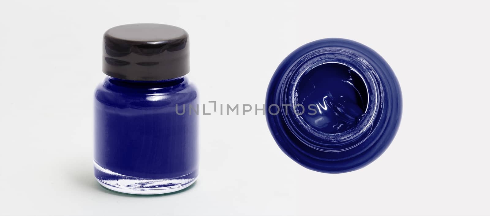 midnightblue acrylic color bottle side and top view white isolated with clipping path