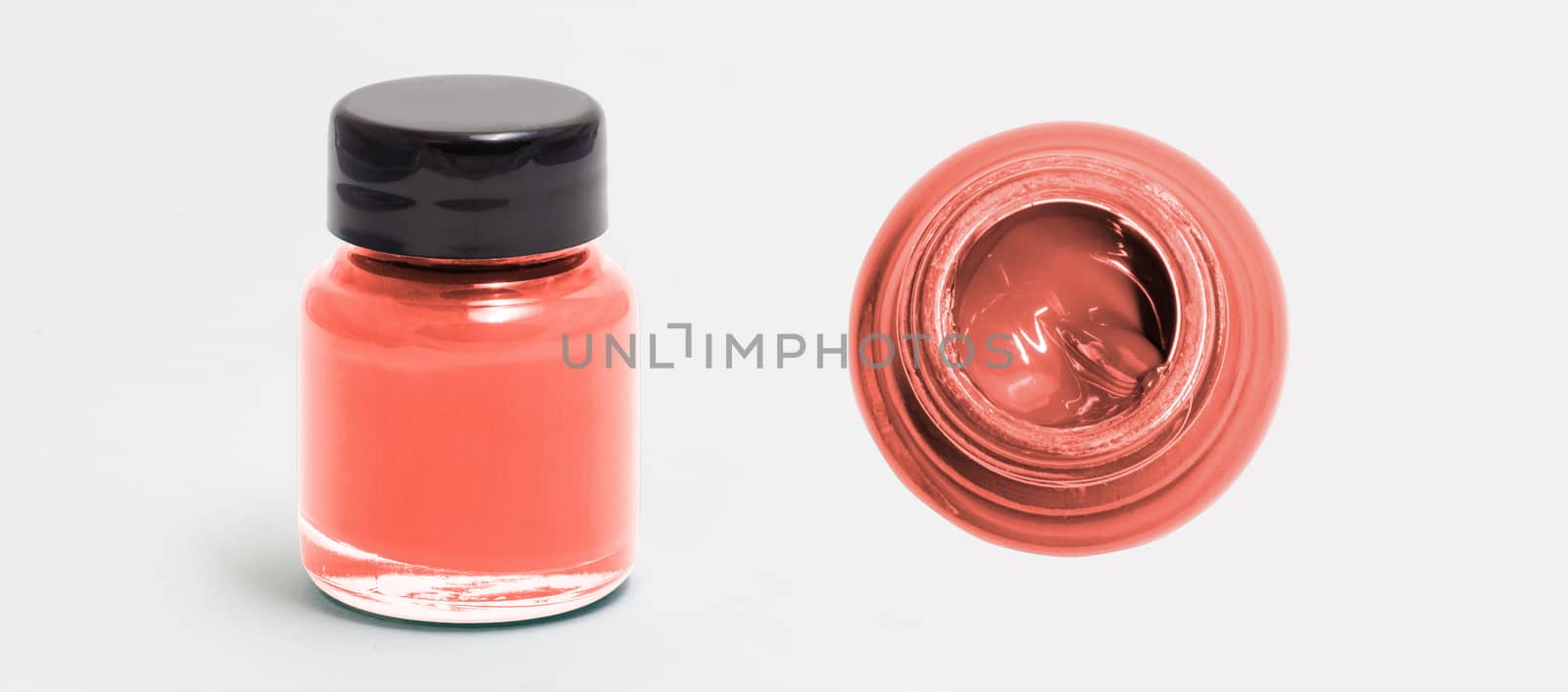 salmonred  acrylic color bottle side and top view white isolated with clipping path
