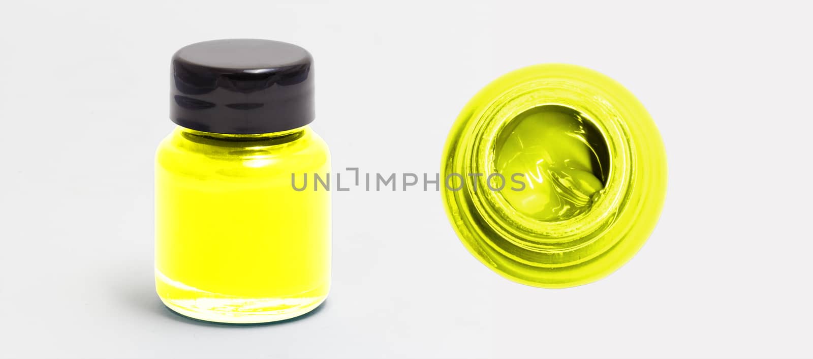 yellow acrylic color bottle side and top view white isolated with clipping path