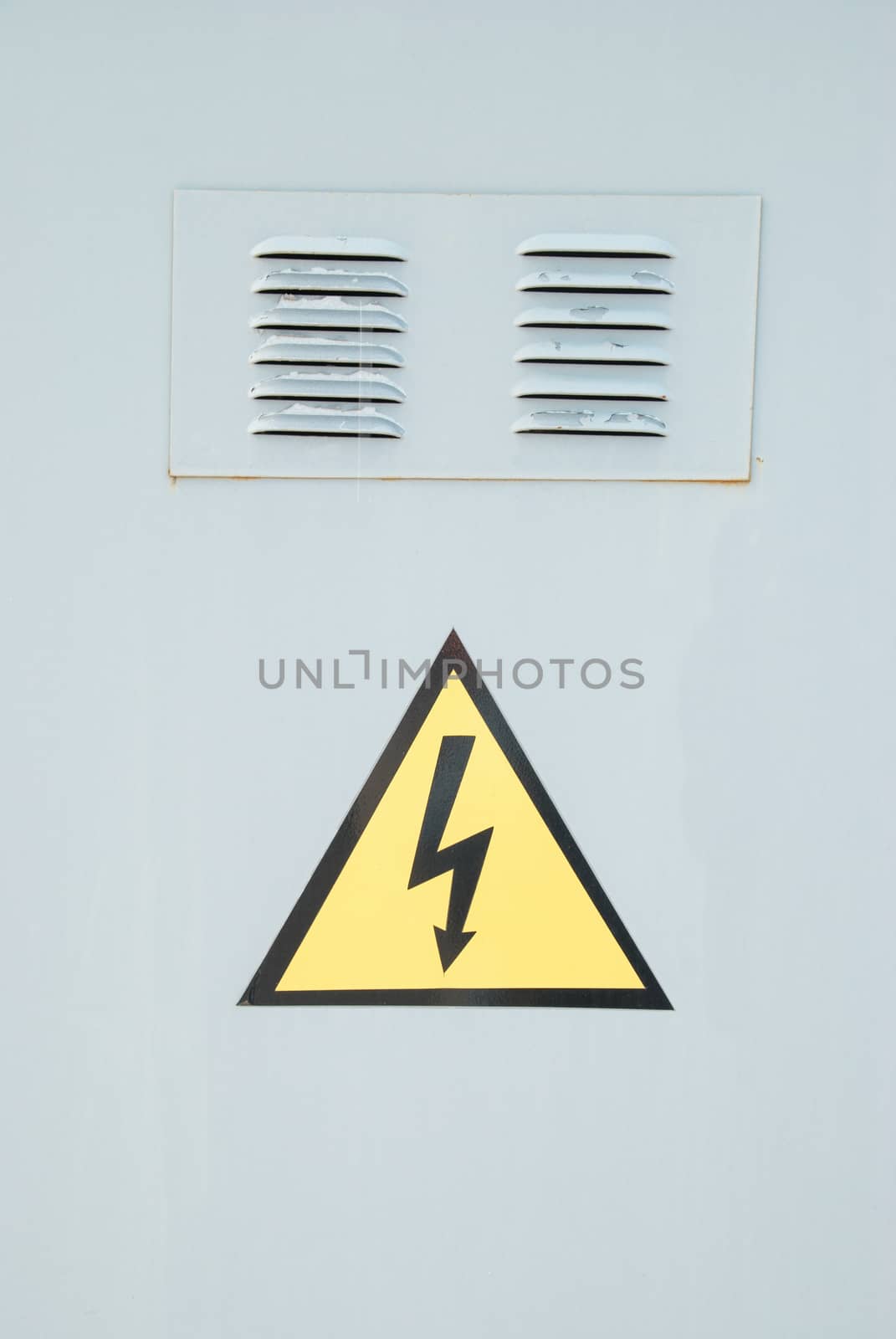 Yellow electric emergency sign with gray background