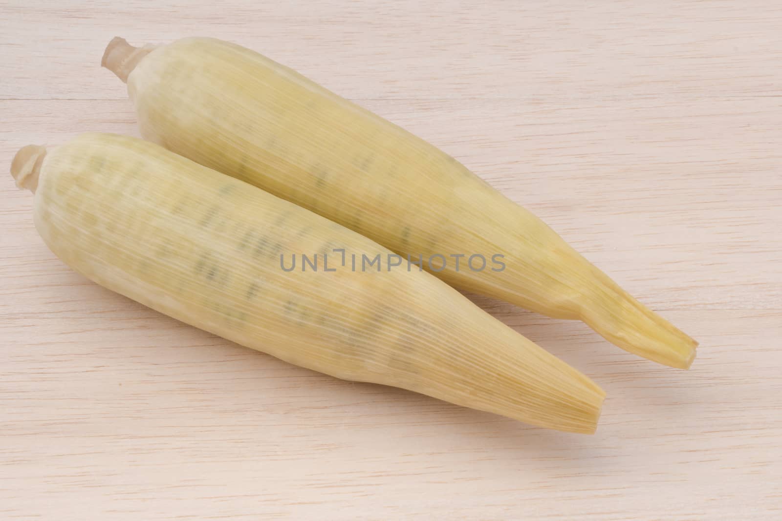 waxy corn,waxy maize on wood background by chingraph