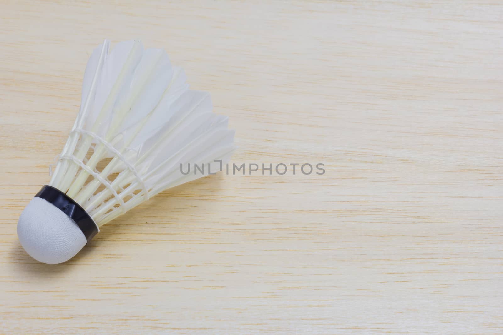 shuttlecock on wood background