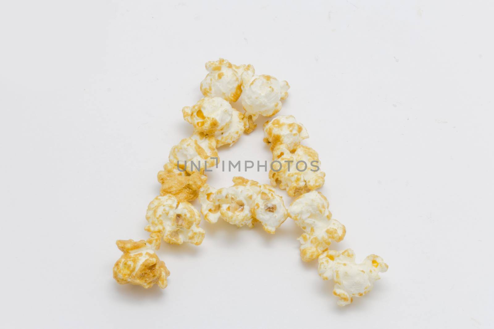 pop corn forming letter A isolated on white background by chingraph