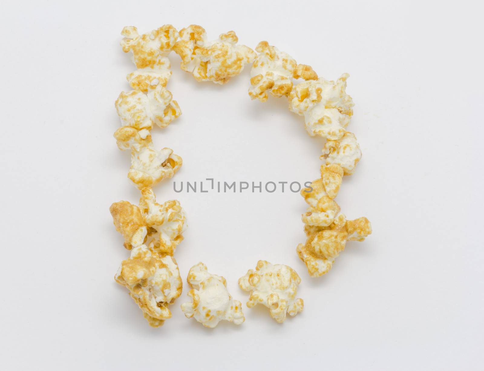 pop corn forming letter D isolated on white background by chingraph