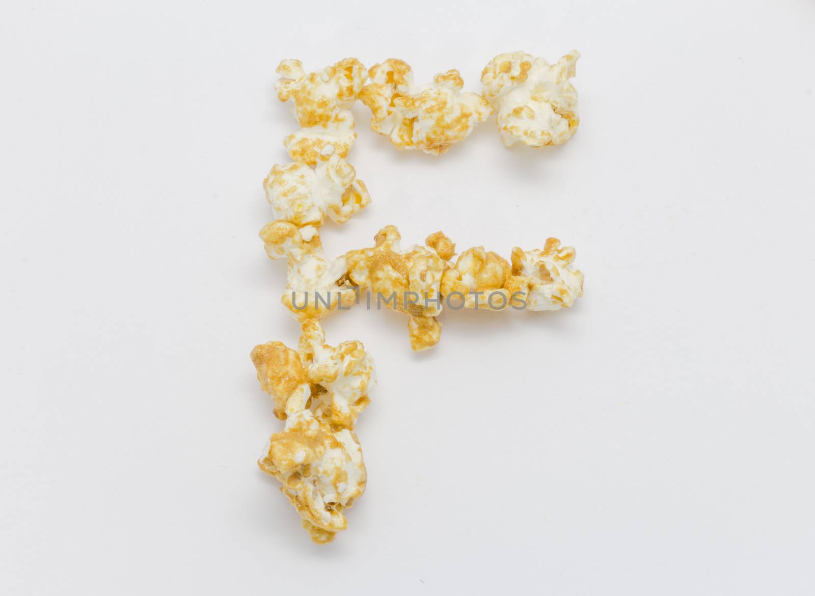 pop corn forming letter F isolated on white background