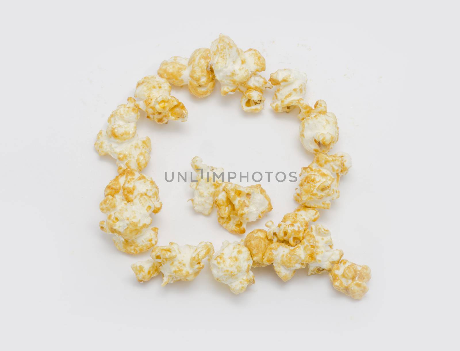 pop corn forming letter Q isolated on white background by chingraph