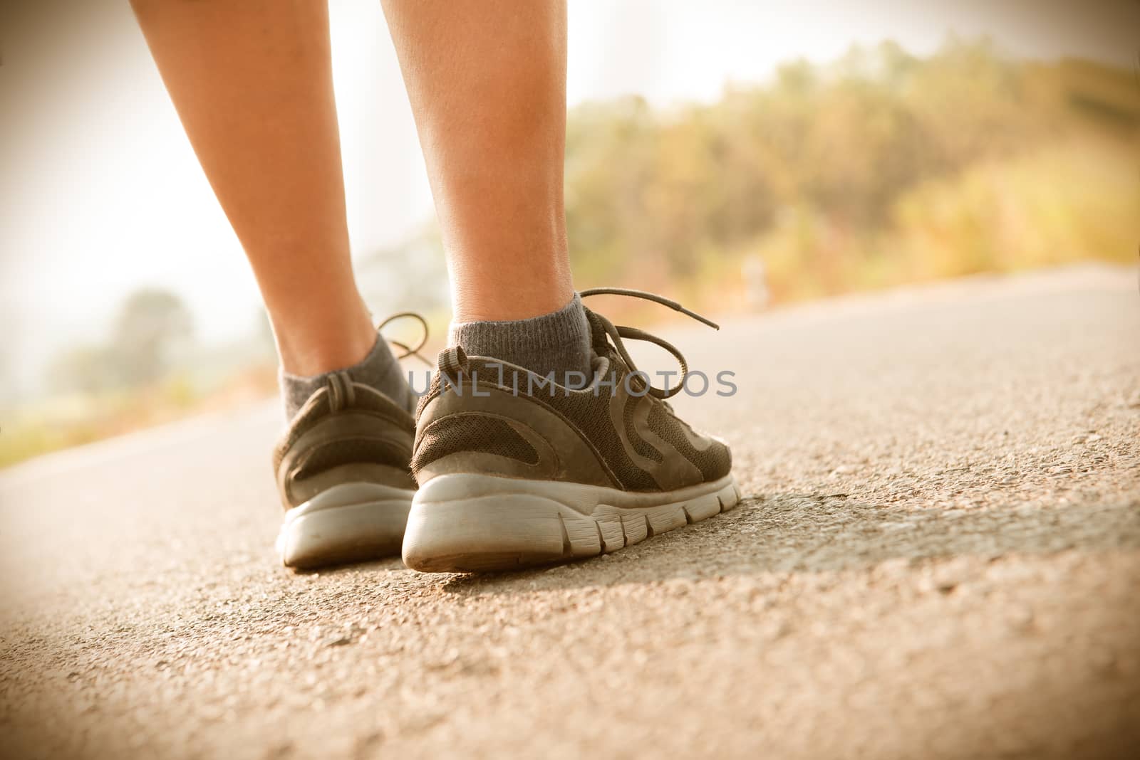 Runner Feet Running on public road Closeup - outdoor shot