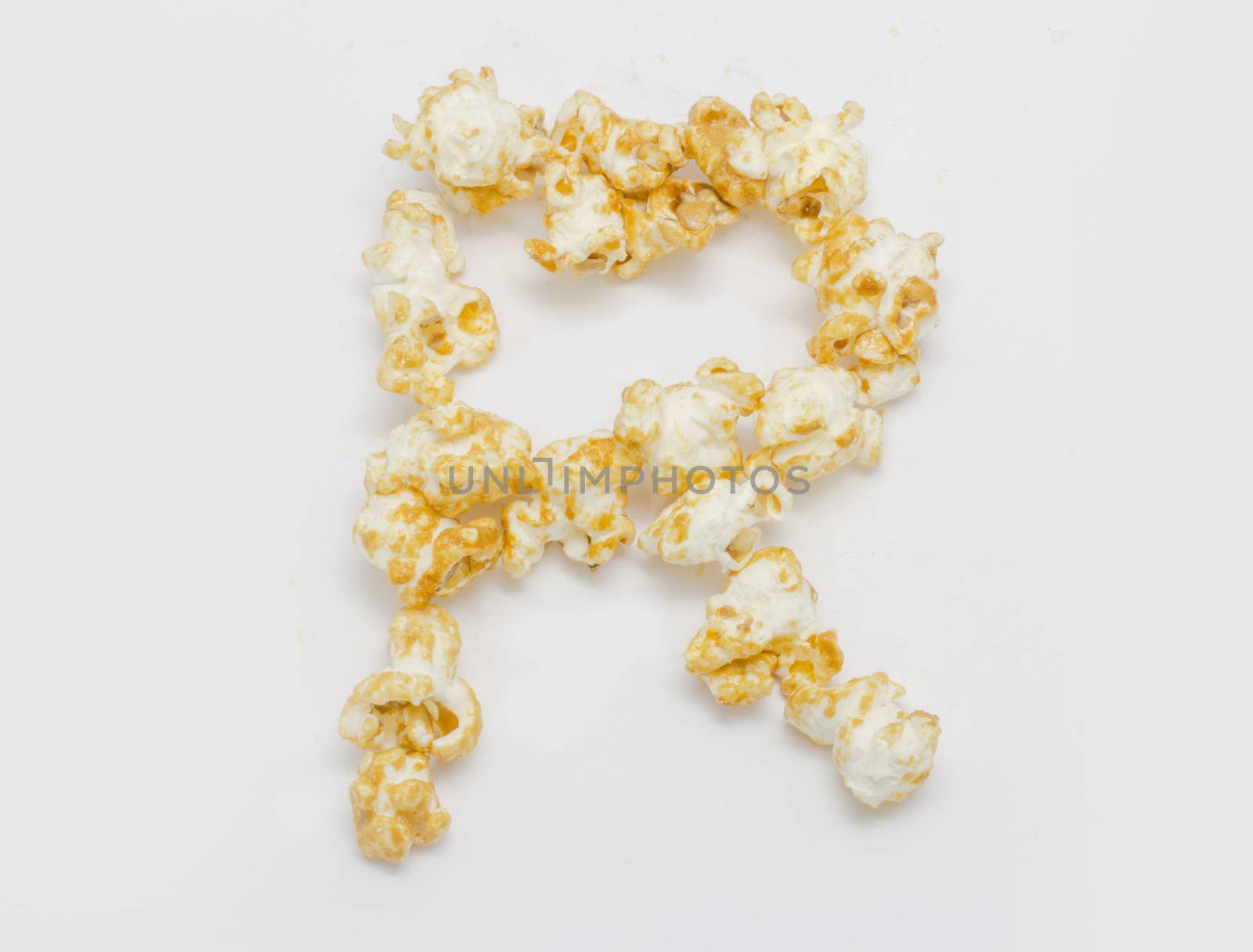 pop corn forming letter R isolated on white background