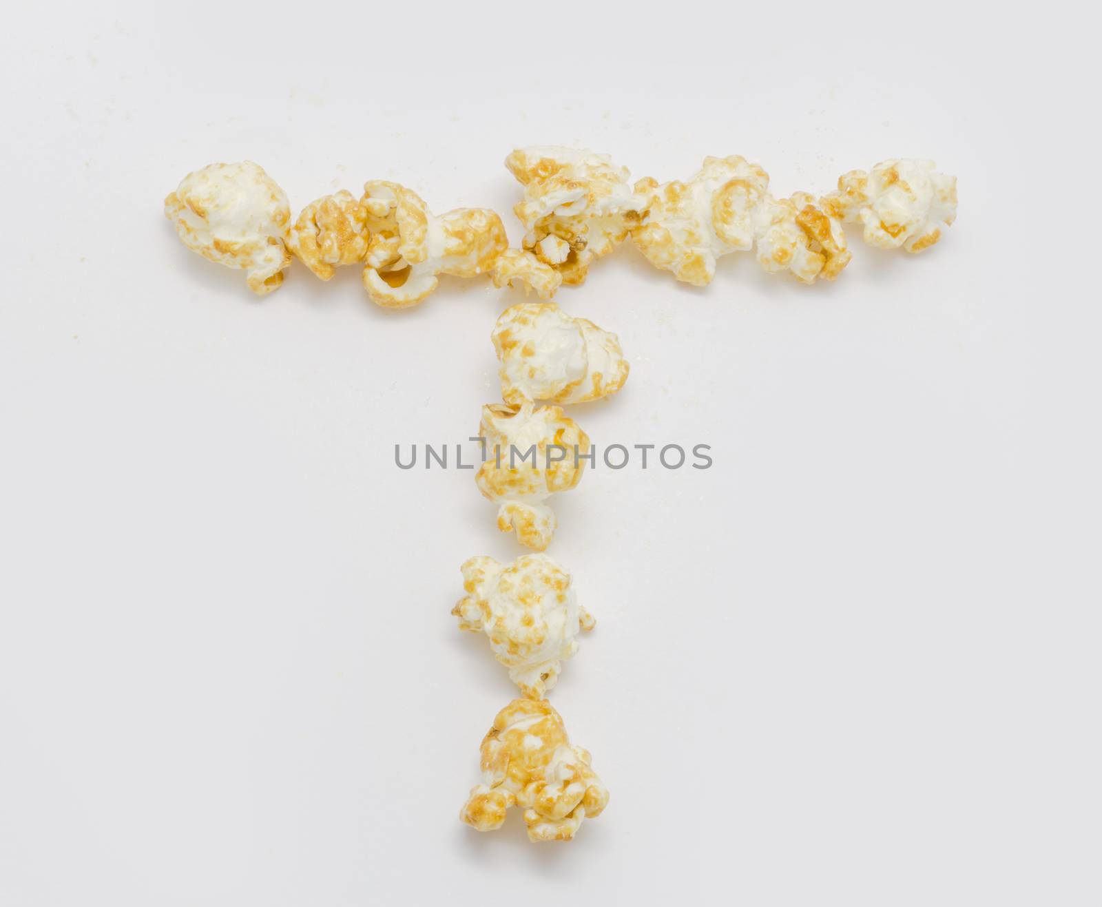 pop corn forming letter T isolated on white background