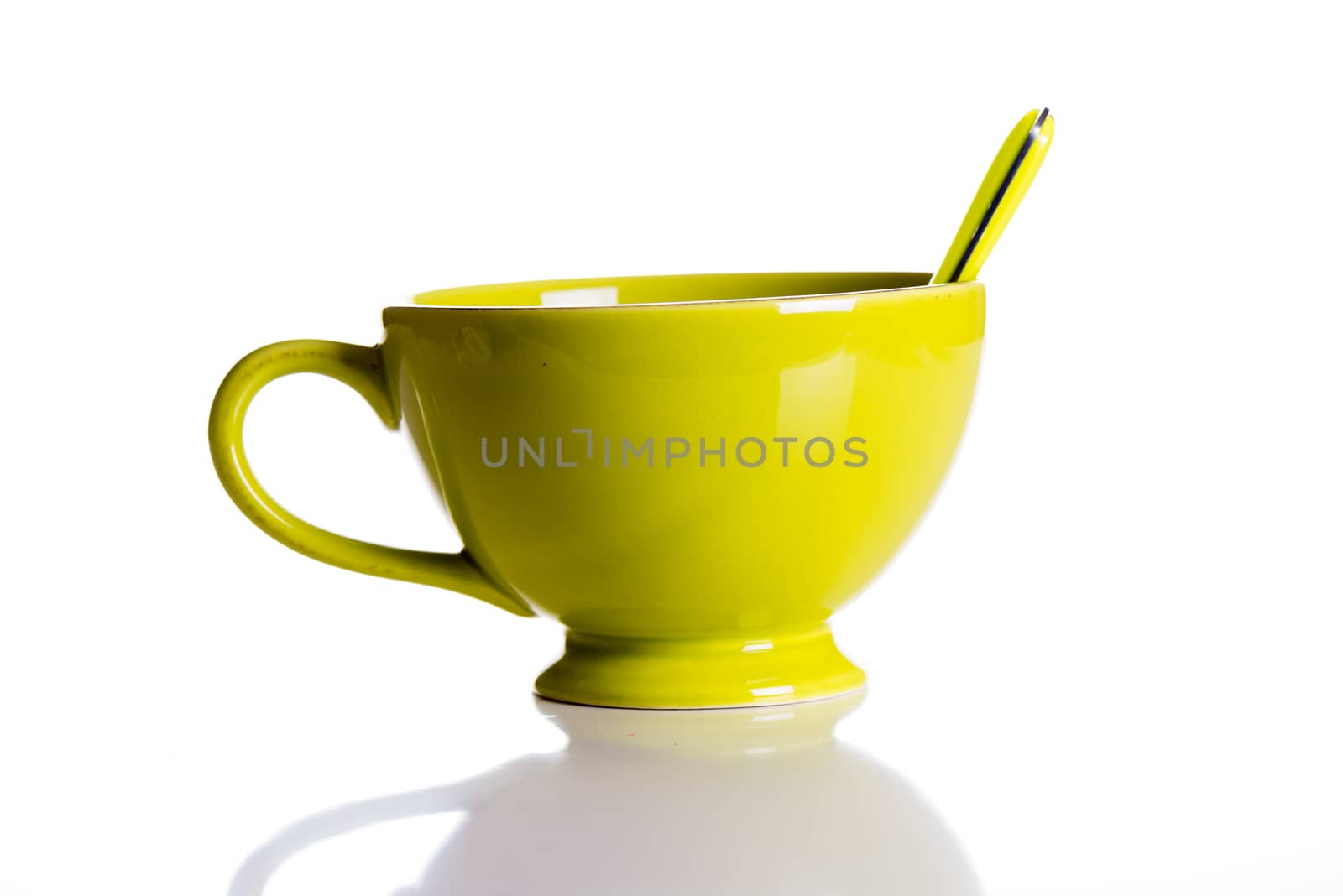 Green jumbo chocolate mug with spoon isolated on white background
